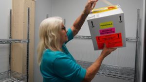 Woman holding a box of donated cornea