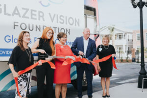 Picture of Robin cutting the ribbon