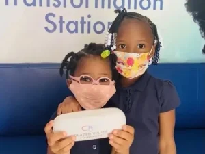 2 children with face masks
