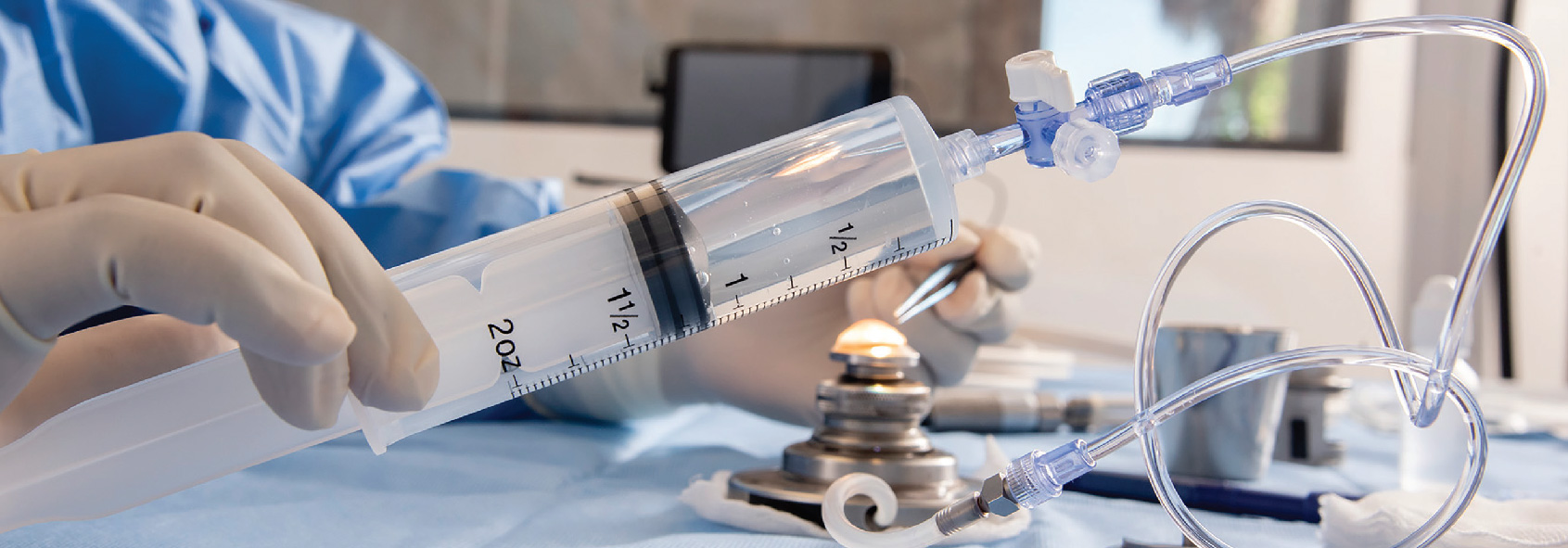 Advanced Cornea Processing Medical professional with a syringe of fluid